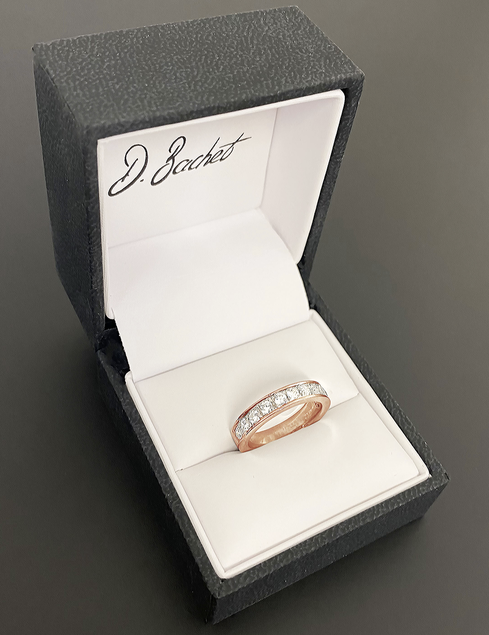 A refined and luxury half eternity diamond wedding band for women in rose gold and white diamonds