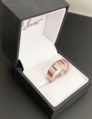 Modern and bold wedding ring, a wide band in pink gold 18k handset with black diamonds