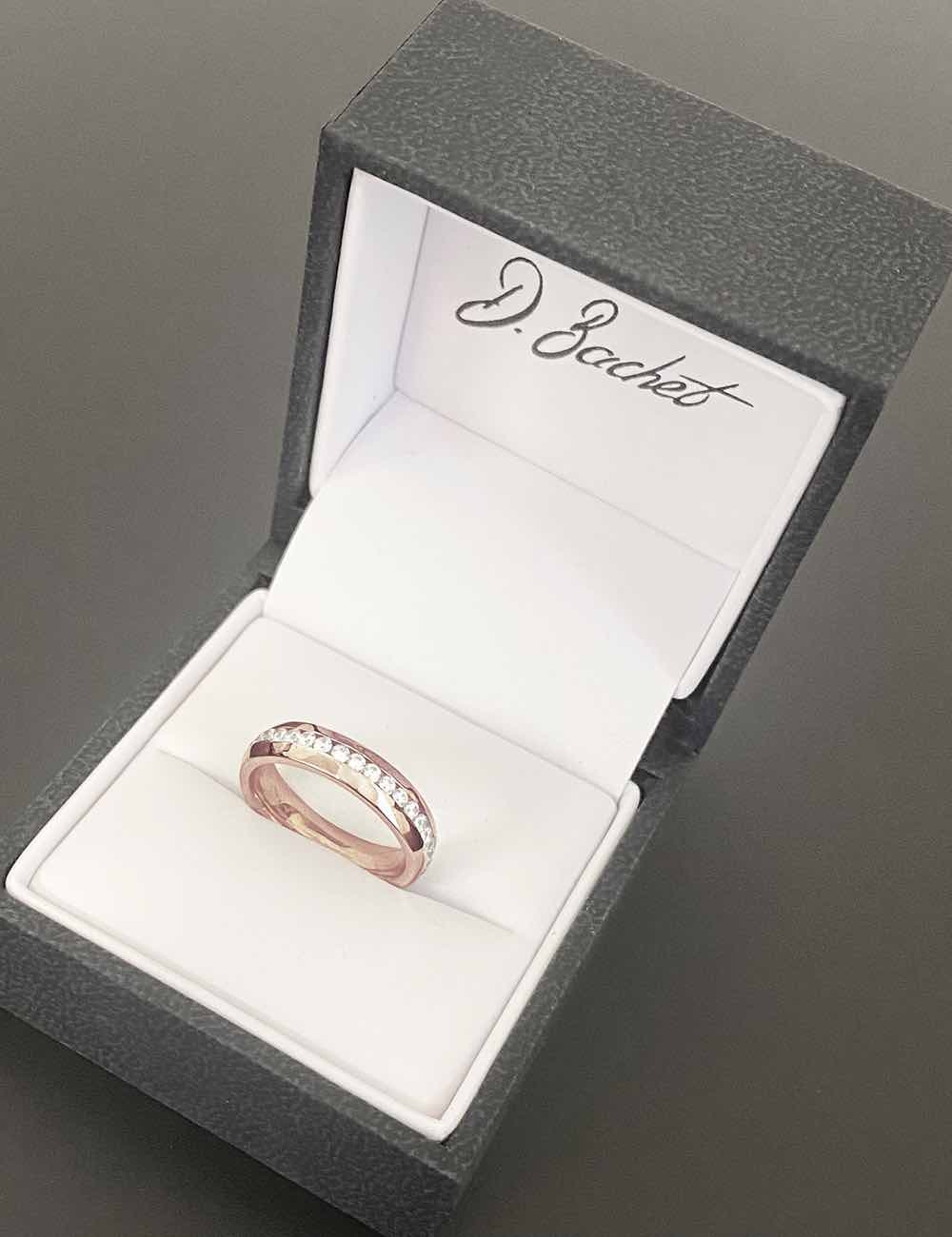A luxury wedding ring for women fully handmade in our workshop in rose gold and white diamonds. A luxury wedding ring for women fully handmade in our workshop in rose gold and white diamonds.