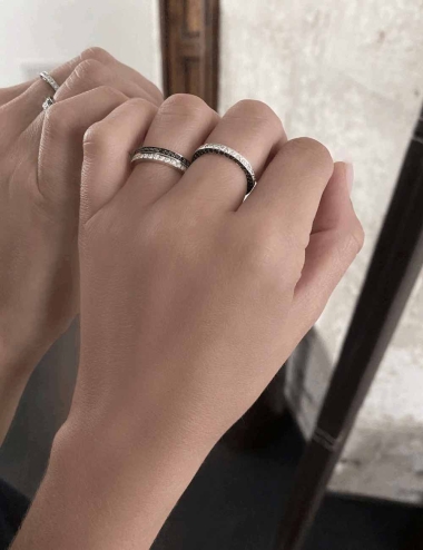 A statement luxury wedding ring, in platinum and grain-set white diamonds and black diamonds