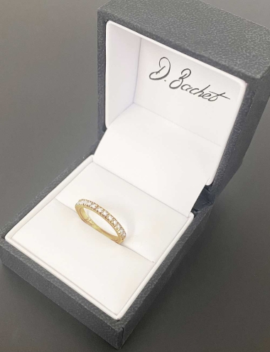 A yellow gold and white diamonds half eternity ring for women