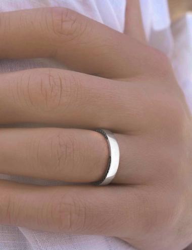 Unique men's wedding band where the white diamonds and black diamonds are handset on each side