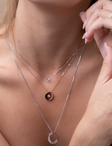 Luxury pendant for women in rose gold with a flower of life to stack with other pendants