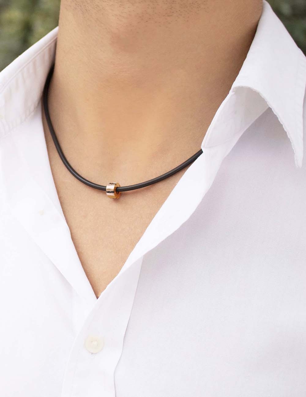 Rose gold A Bridge to Unity pendant with black diamonds, an elegant and graphic men's jewelry piece.