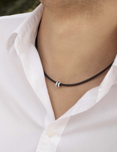 White gold and black diamonds modern pendant for men on a black silicone cord