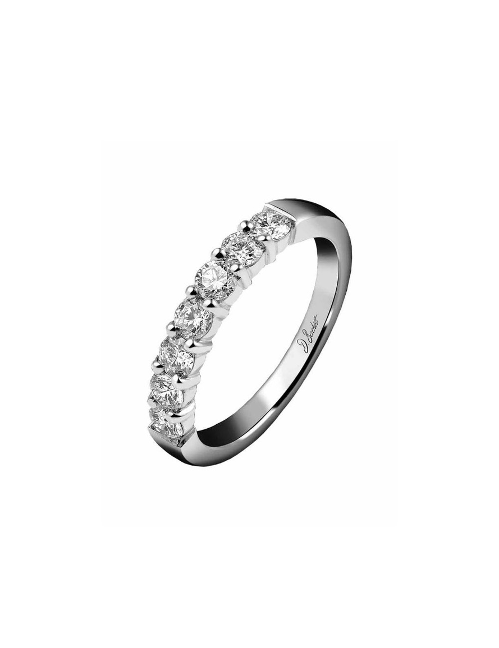 Platinum wedding ring for women, elegantly designed with white diamonds in prong settings, radiating sophistication.