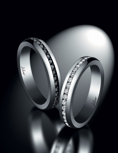Matching eternity wedding bands for women and men set with white diamonds and black diamonds