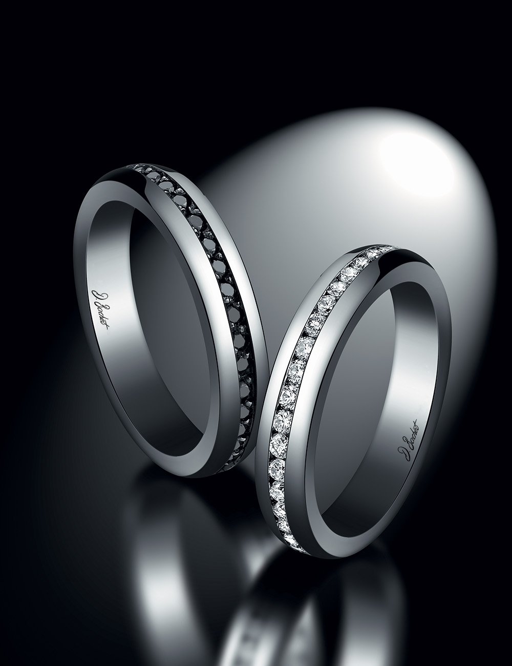 Traditional and creative men's wedding ring in platinum with set black diamonds, made in France.