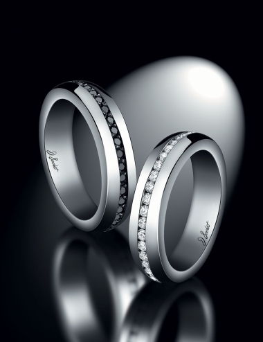 Matching eternity wedding rings set with white diamonds and black diamonds