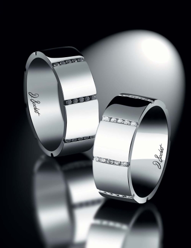 Matching wide wedding bands for couple in white diamonds and black diamonds