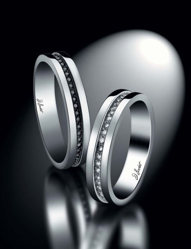 Matching eternity wedding rings for couple set with white diamonds and black diamonds