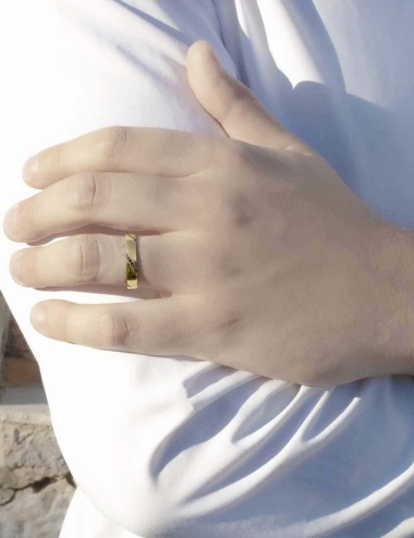 Modern wedding band for men in yellow gold set with black diamonds