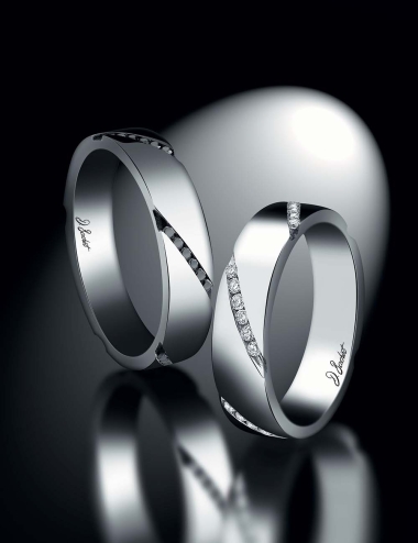 Matching wedding bands with an original design set with white diamonds and black diamonds