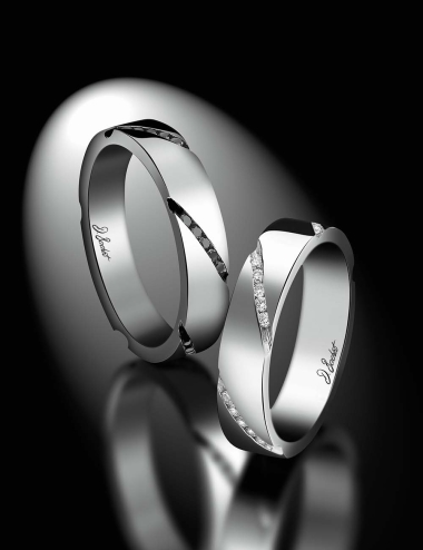 Matching wedding band with an original and modern design set with white diamonds and black diamonds