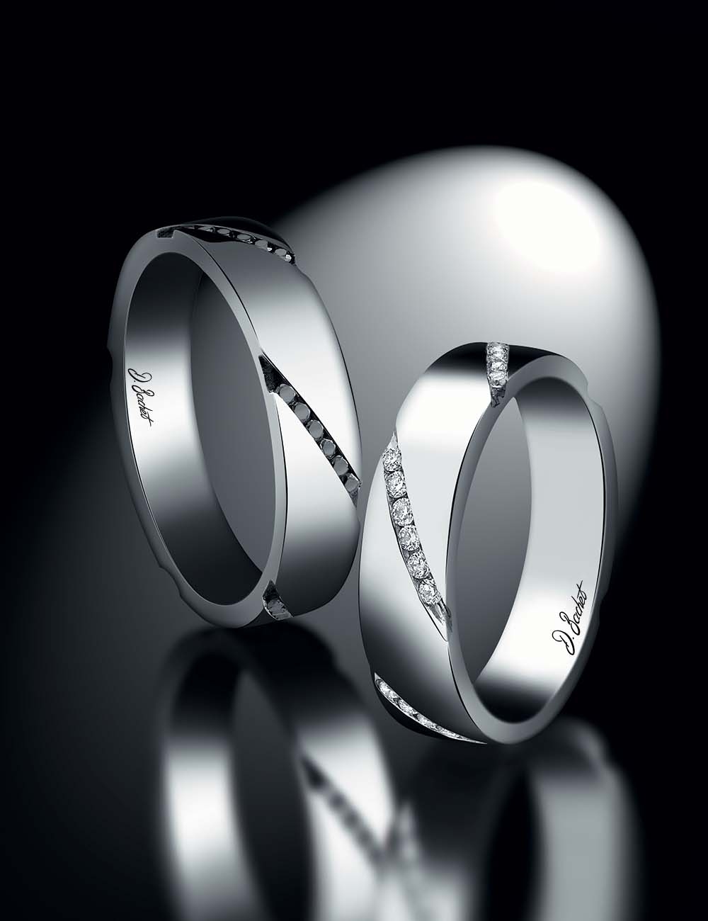 Modern white diamond wedding band in platinum, stackable, with a ribbon-like design, also in black diamonds.