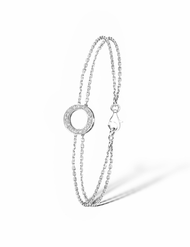 Un bracelet pour femme en forme de cercle, fabriqué en or blanc 750 et orné de diamants blancs.