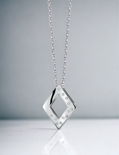 A women's pendant in a diamond shape, made of gold and adorned with white diamonds, suitable for everyday wear.