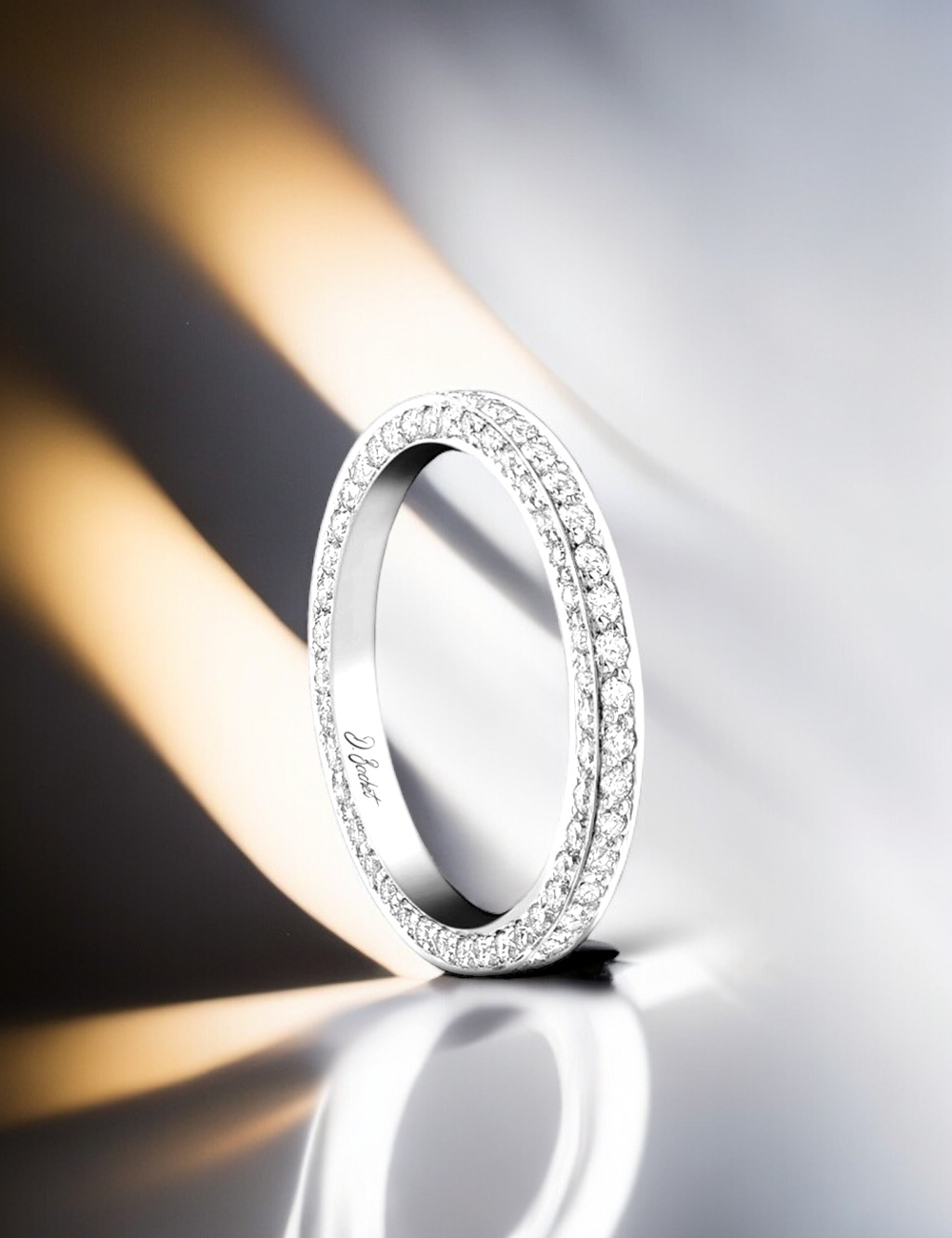 Women's wedding band in platinum, with white diamonds set on top and each side, captivating sparkle, ethically sourced