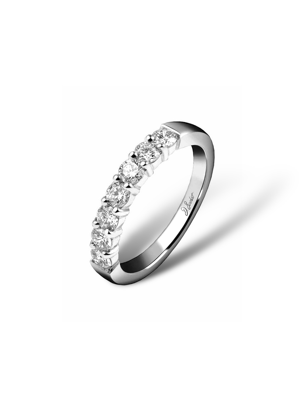 Platinum wedding ring for women, elegantly designed with white diamonds in prong settings, radiating sophistication.
