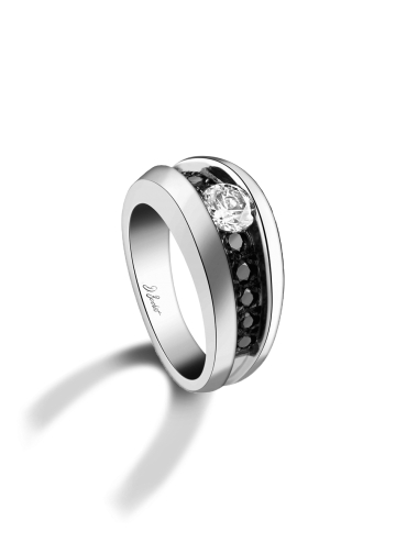 Modern women's ring set with a 0.30 carat white diamond and black diamonds.