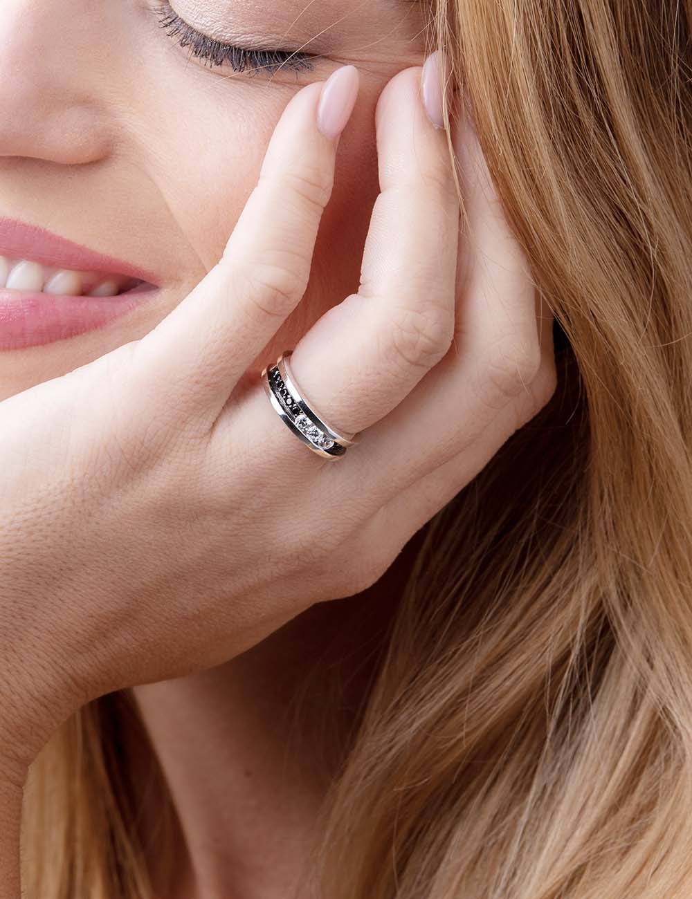 D.Bachet Trilogy ring featuring a trio of white diamonds surrounded by black diamond pavé, epitome of luxury and elegance.