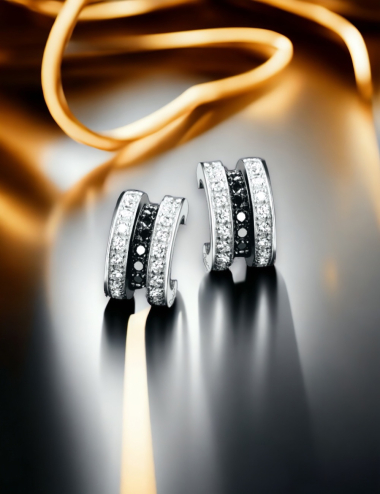 D.Bachet half-hoop earrings in white gold with black and white diamonds.