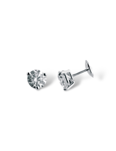 Timeless jewel: Diamond earrings with three-prong setting, magnified brilliance.