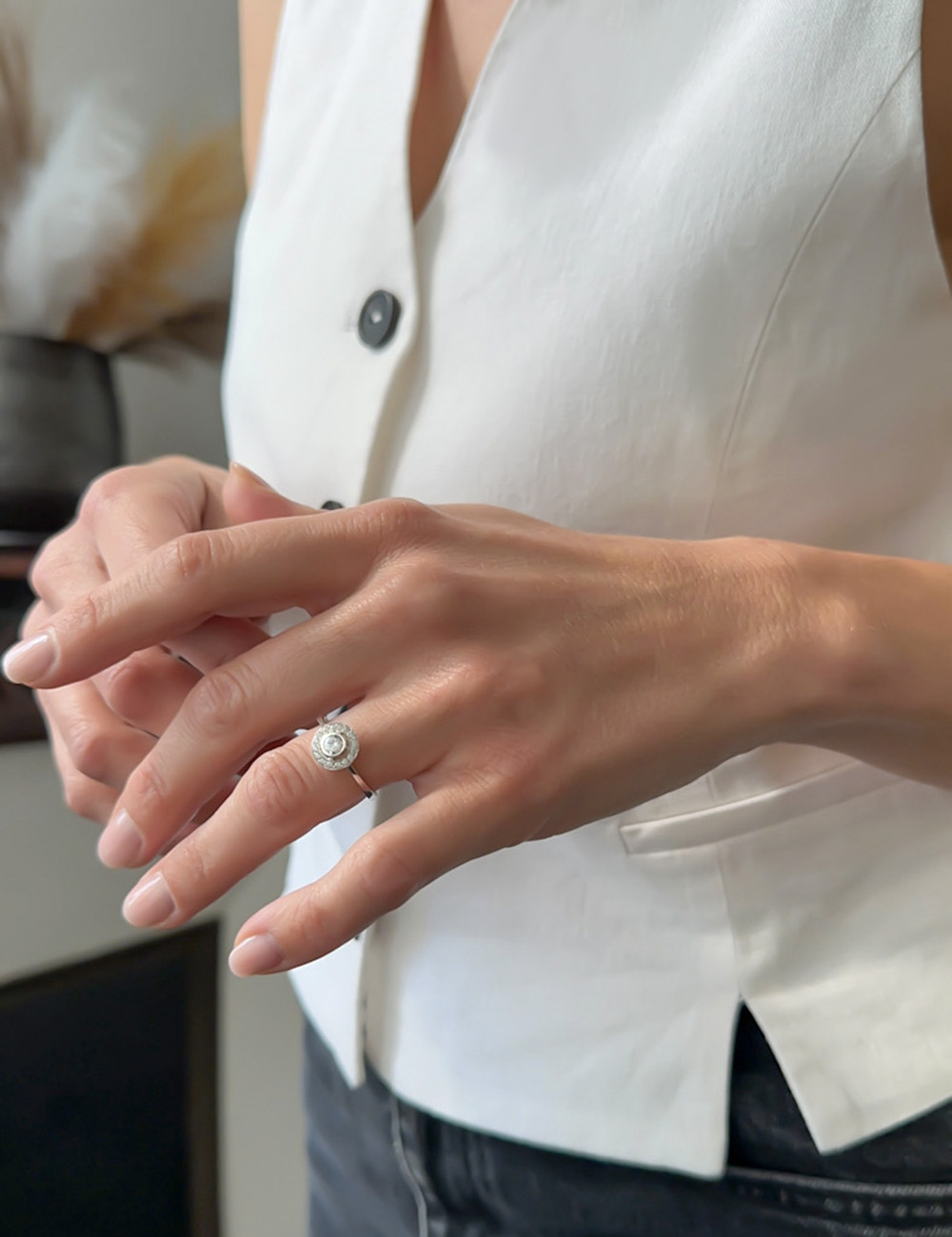 Platinum halo ring with 0.30 ct central white diamond, radiance and eternal love symbol, guaranteed elegance.