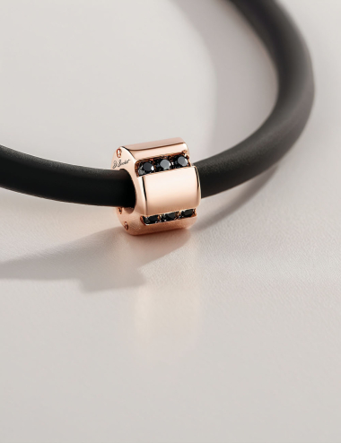 Rose gold A Bridge to Unity pendant with black diamonds, an elegant and graphic men's jewelry piece.