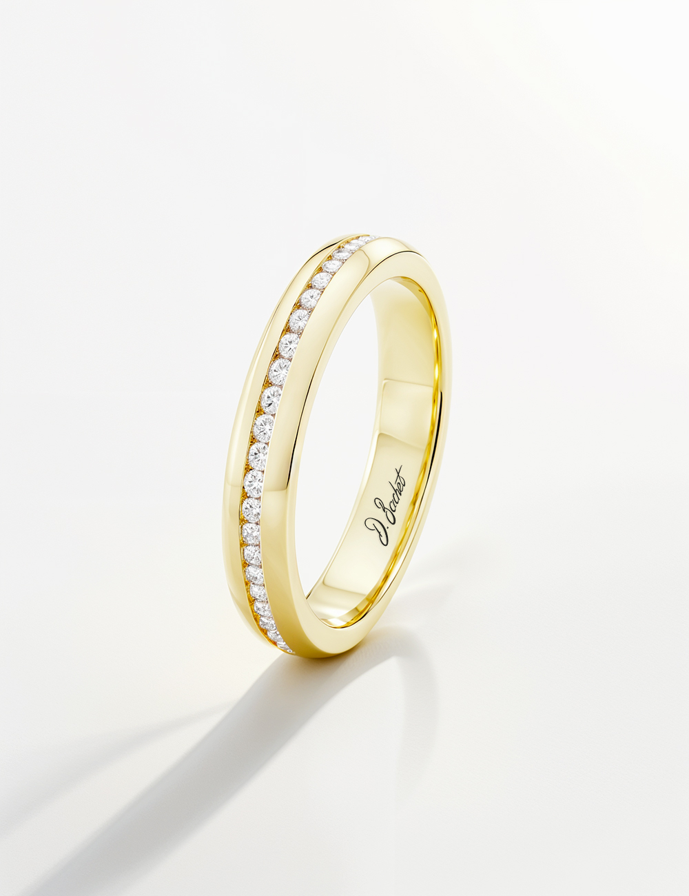 Yellow gold wedding band with channel-set diamonds, minimalist D.Bachet design. Yellow gold wedding band with channel-set diamonds, minimalist D.Bachet design.