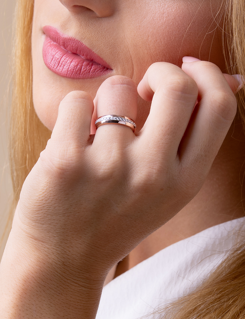 Rose gold and diamond wedding band worn, soft glow and delicate finish by D.Bachet.