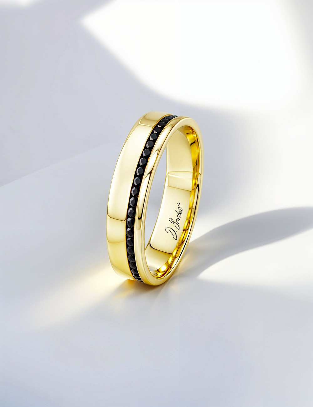 Men’s wedding band in 18k yellow gold with black diamonds, modern and elegant design for contemporary style.