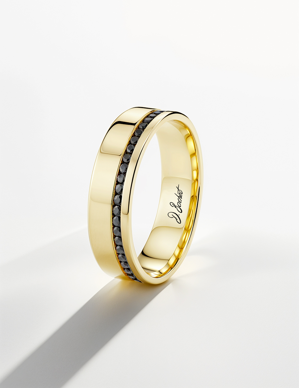 Flat and wide yellow gold and black diamonds eternity band for men.