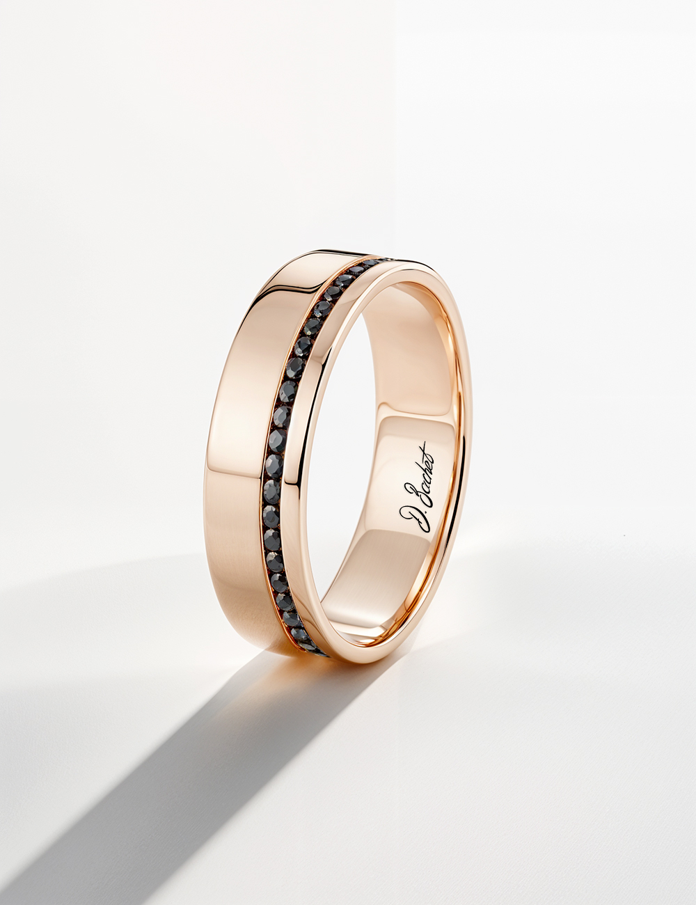 Rose gold flat band ring for men, graphic style with a refined offset black diamond setting.