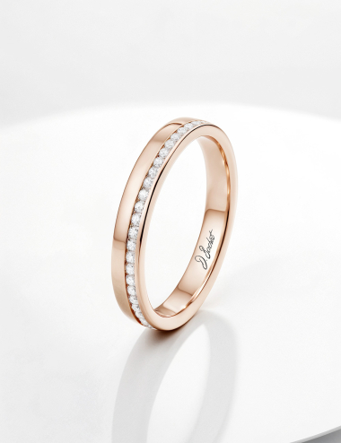 A thin and flat rose gold and white diamonds eternity wedding ring.