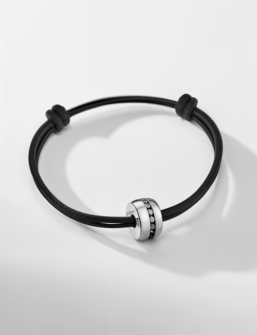 Men’s bracelet in 18k white gold, black diamonds, with adjustable black cord. Elegant and bold.