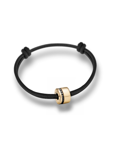 Bracelet masculin or jaune et diamants noirs, monté sur cordon noir à nœuds coulissants.