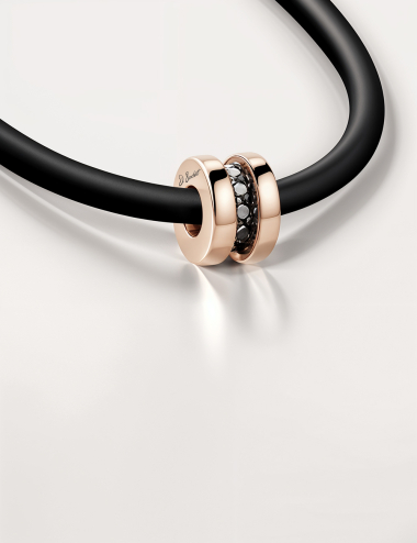 Rose gold necklace for men, set with black diamonds, on black cord and gold clasp.