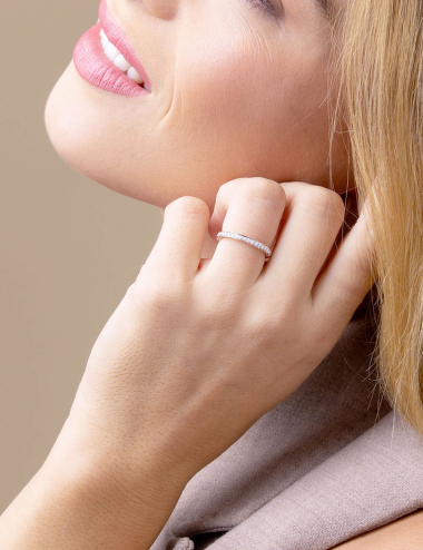 Rose gold diamond wedding band with grain-set white diamonds, luxury bridal jewelry by D.Bachet.