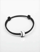 Men’s bracelet in white gold with black diamonds on an adjustable black cord, a contemporary D.Bachet jewel.