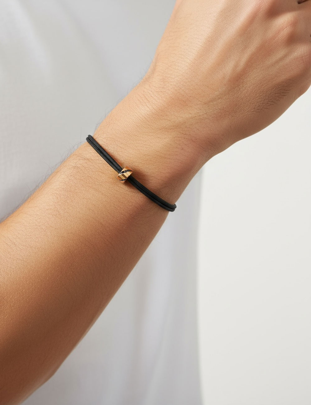 Rose gold 18k bracelet for men with black diamonds and adjustable knotted black cord.