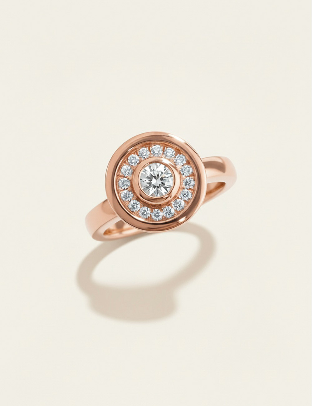 Allure rose gold ring with a central diamond and white diamond halo, modern brilliance by D.Bachet.