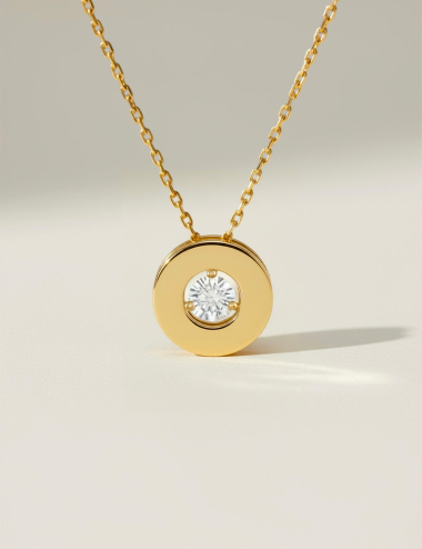 Yellow gold necklace with suspended diamond, luminous and elegant creation by D.Bachet.
