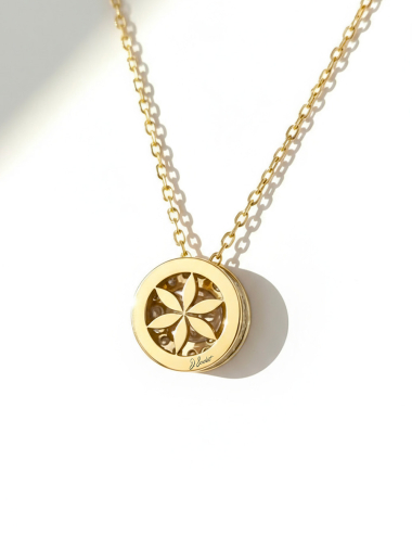 Back of 18k yellow gold pendant with openwork flower-of-life motif and diamonds.