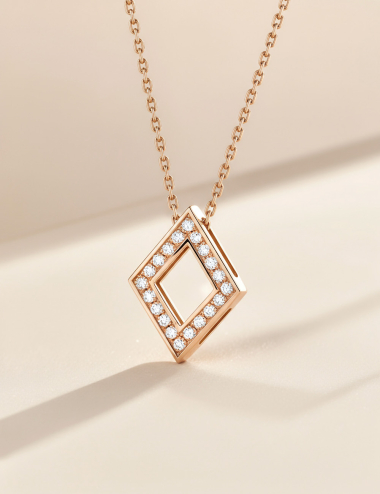 Women’s 18k white gold lozenge pendant set with white diamonds.