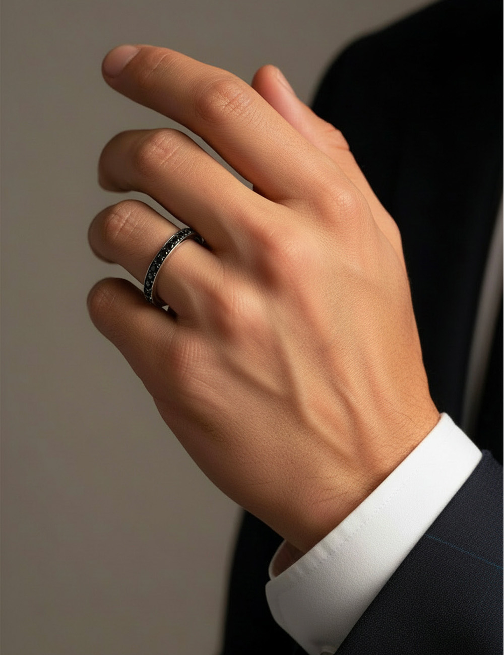 Unisex platinum wedding ring with black diamond pavé, slim and modern design.