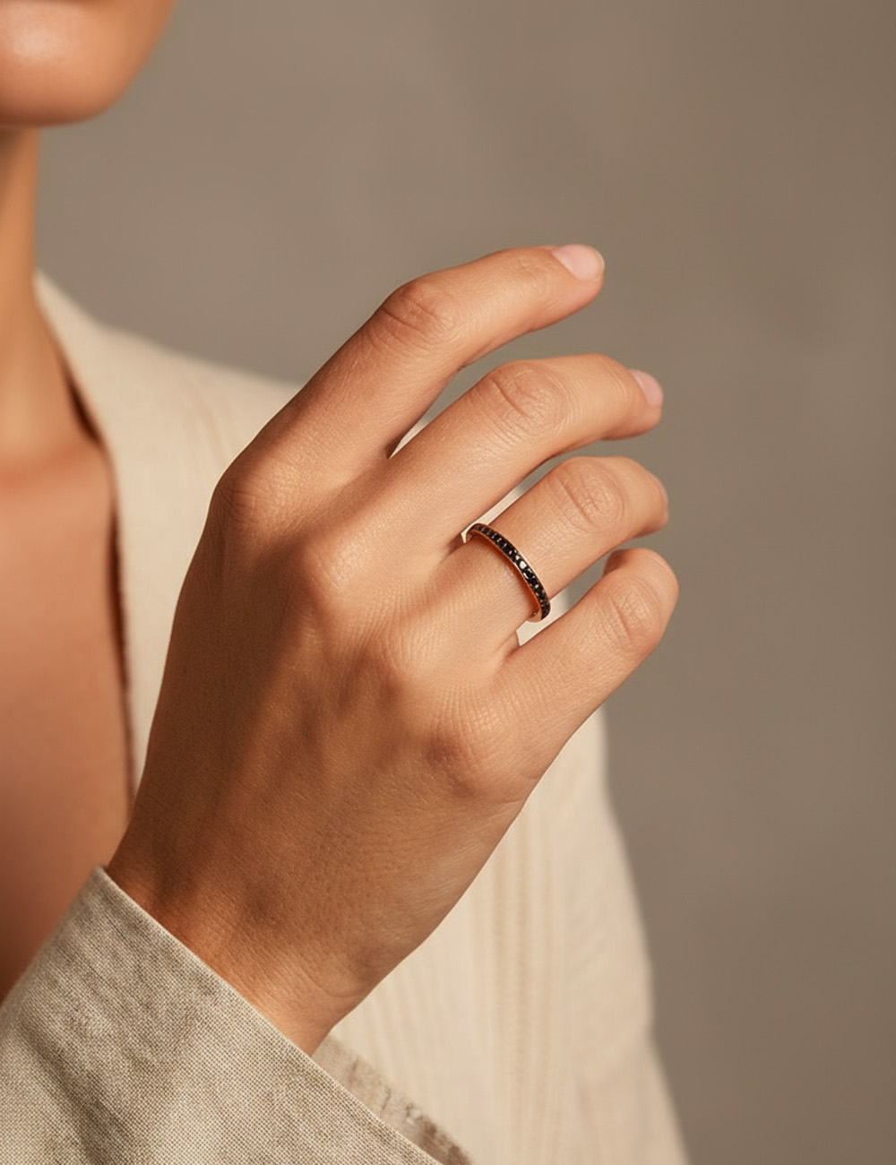 Rose gold women’s wedding ring set with black diamonds, sleek contemporary style.