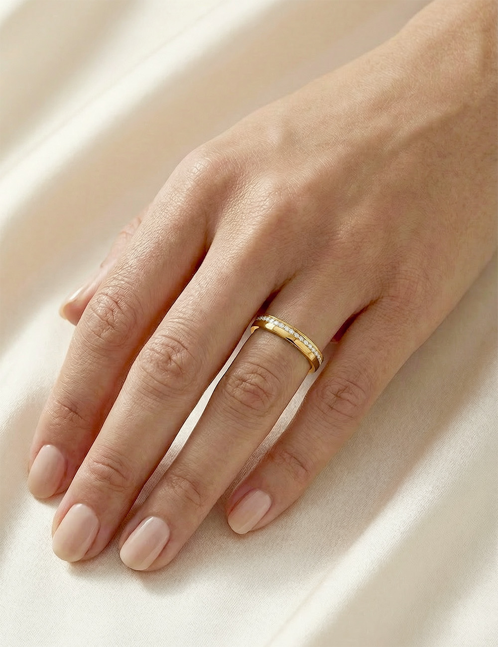 Yellow gold wedding band with white diamonds, full eternity setting, 3 mm width, elegant and sophisticated design.