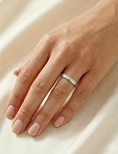 Platinum women's wedding band with white diamonds in full eternity setting, 3 mm width, modern and elegant design.