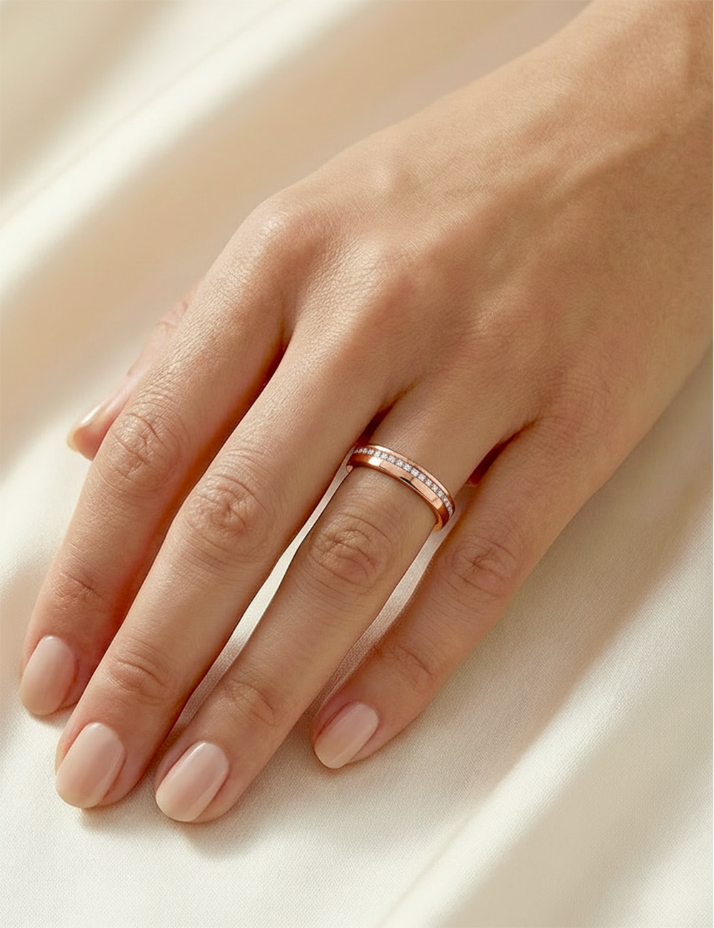 Rose gold wedding band with white diamonds, full eternity setting, 3 mm width, minimalist and refined design.